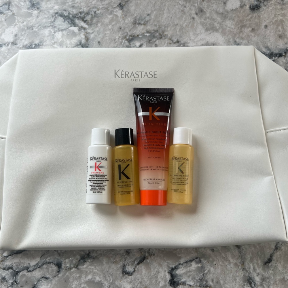 Kerastase White Leather Makeup bag with four Kerastase products
